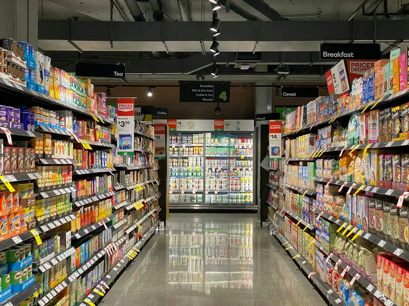 a shop aisle with stocked shelves