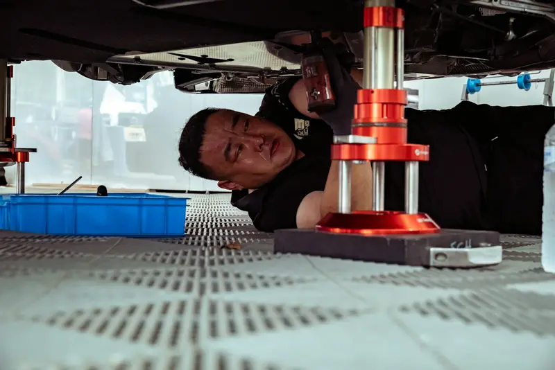 a mechanic working under a vehicle