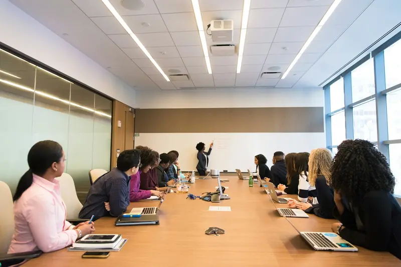 a room listening to someone speaking